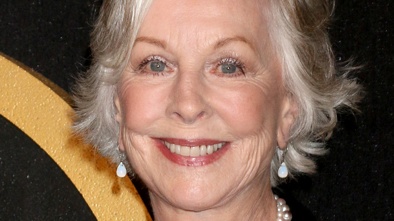 Christina Pickles smiling for photos