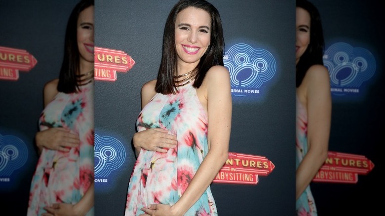 Christy Carlson Romano cradling stomach