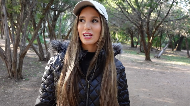 Christy Carlson talking outdoors