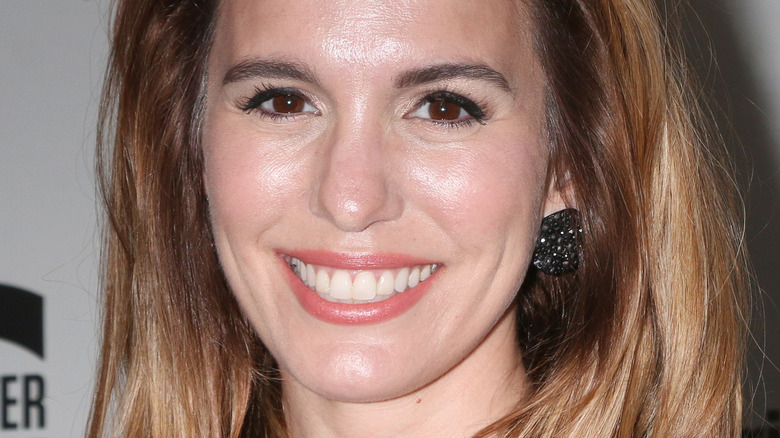 Christy Carlson Romano with wide smile on the red carpet