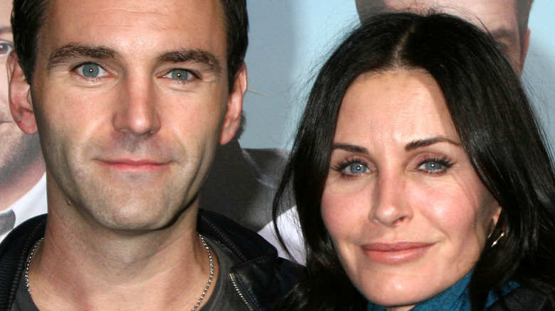 Johnny McDaid and Courteney Cox smiling