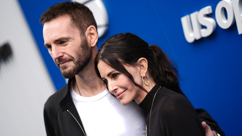 Johnny McDaid and Courteney Cox smiling