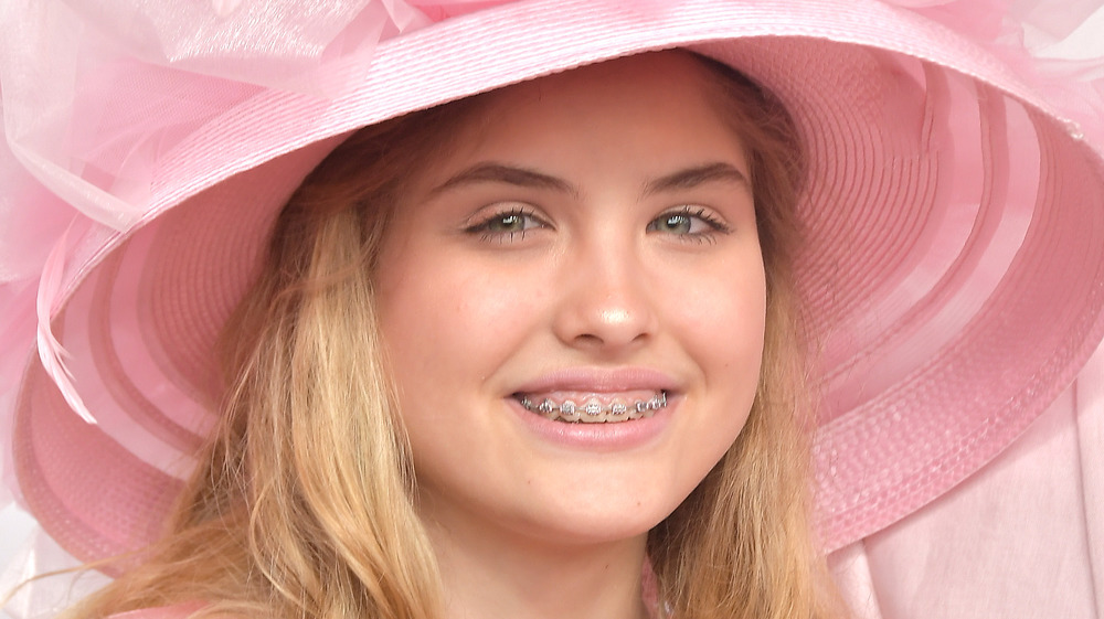 Dannielynn Birkhead in pink smiles for photos at an event