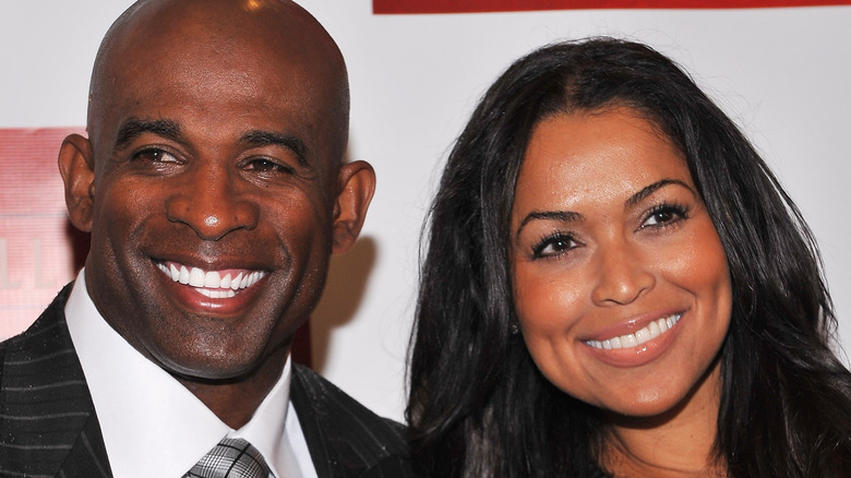 Deion Sanders and Tracey Edmonds smiling