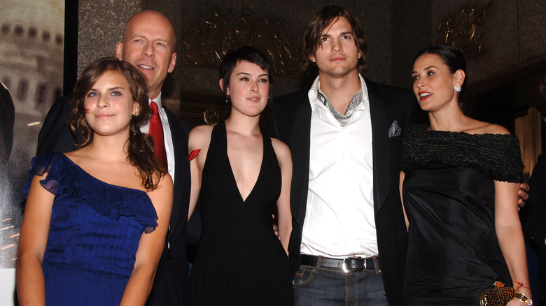 Bruce, Tallulah, and Rumer Willis posing with Ashton Kutcher, Demi Moore