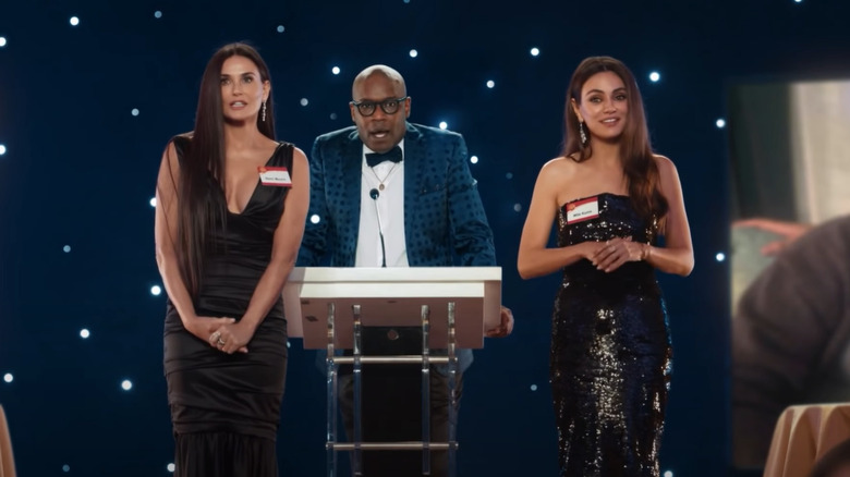 Demi Moore, Mina Kunis in front of announcer