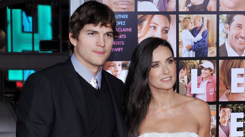 Ashton Kutcher, Demi Moore posing