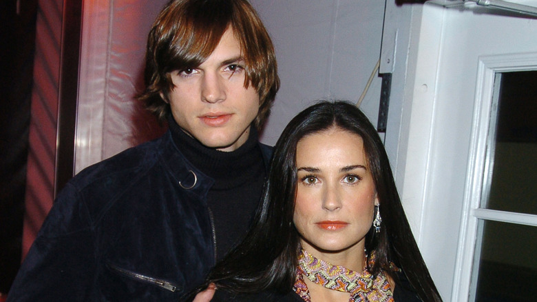 Ashton Kutcher, Demi Moore with intense expressions