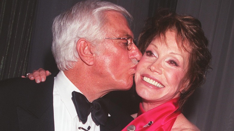 Dick Van Dyke kissing Mary Tyler Moore