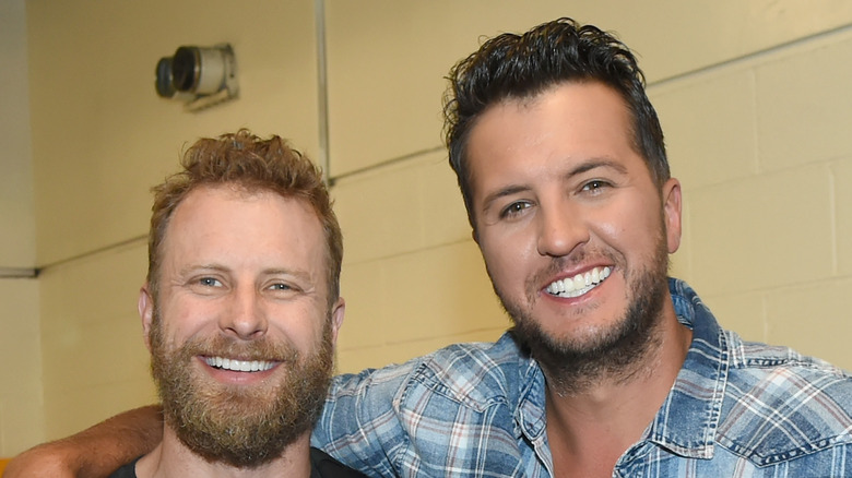 Dierks Bentley smiling with Luke Bryan