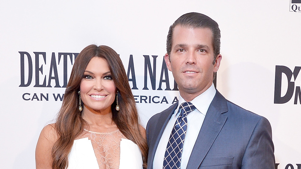 Kimberly Guilfoyle and Donald Trump Jr. at step and repeat
