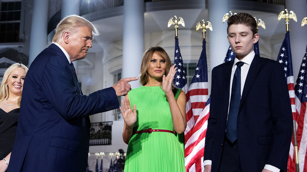 Donald Trump, Melania Trump, and Barron Trump on the South Lawn in 2020