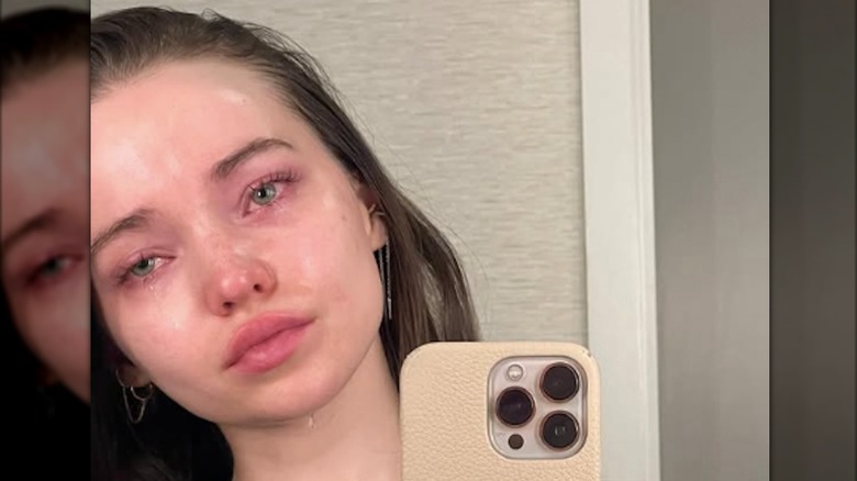 Selfie of Dove Cameron with tears running down her cheeks