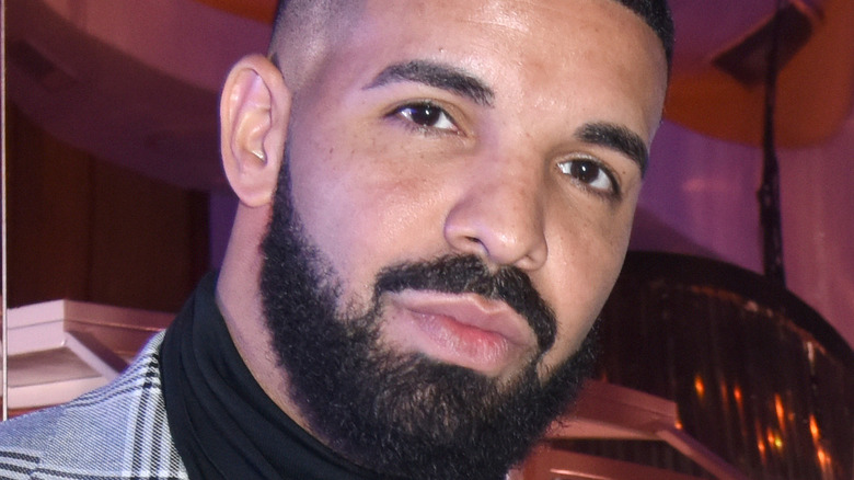 Drake wearing a suit