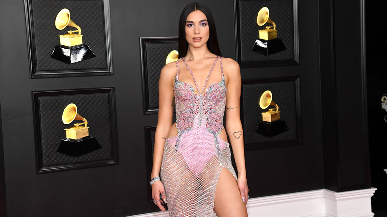 Dua Lipa posing at the Grammy Awards