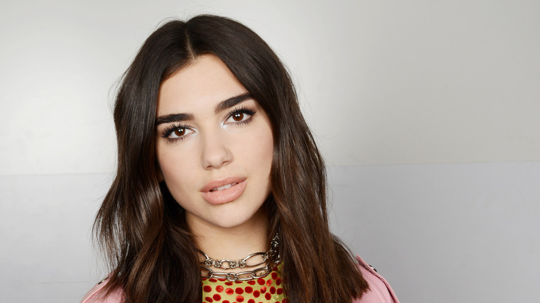 Dua Lipa gazing at camera