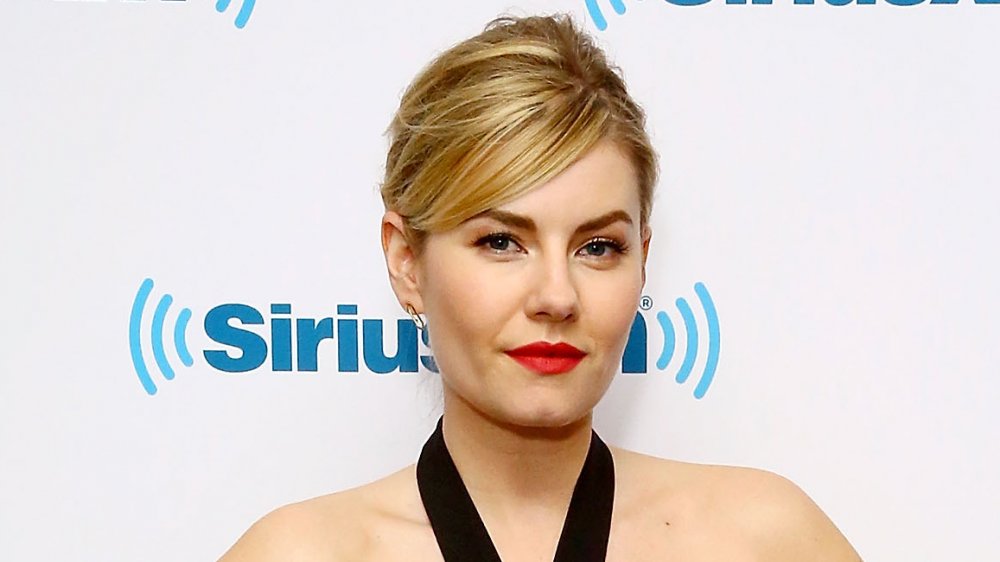 Elisha Cuthbert with red lips and updo 