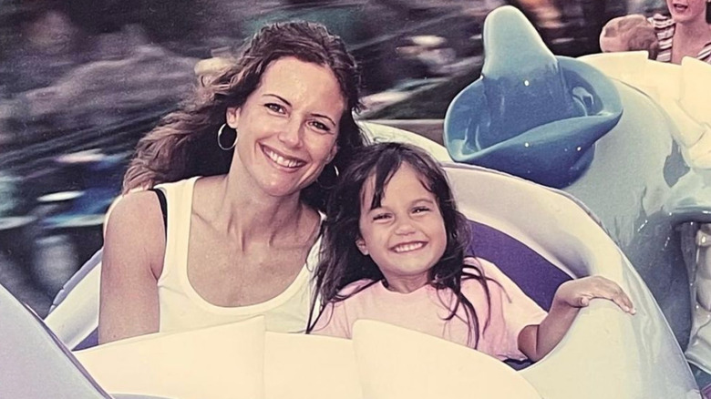 Kelly Preston and Ella Travolta smiling on ride