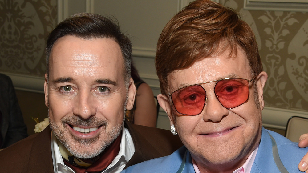 Elton John and David Furnish smiling