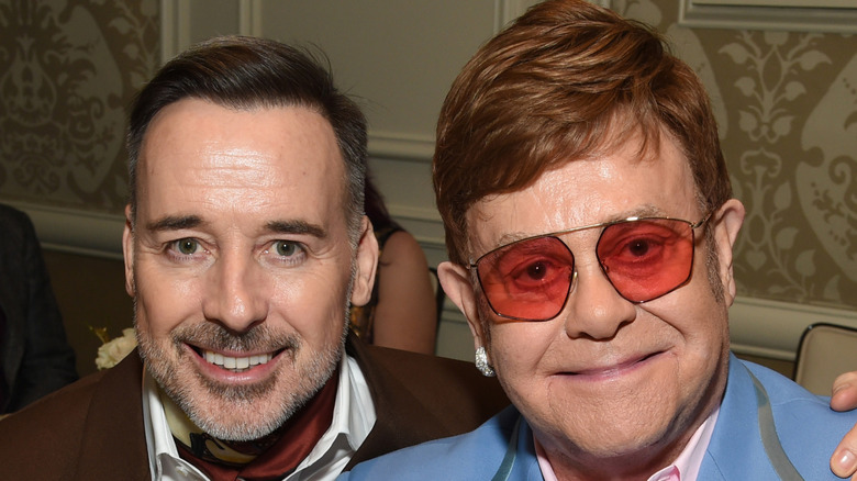 Elton John and David Furnish smiling