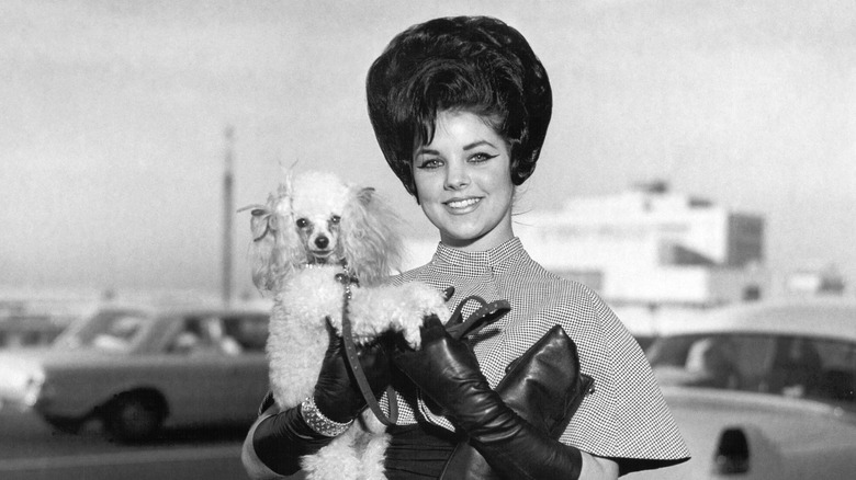 Priscilla poses with puppy