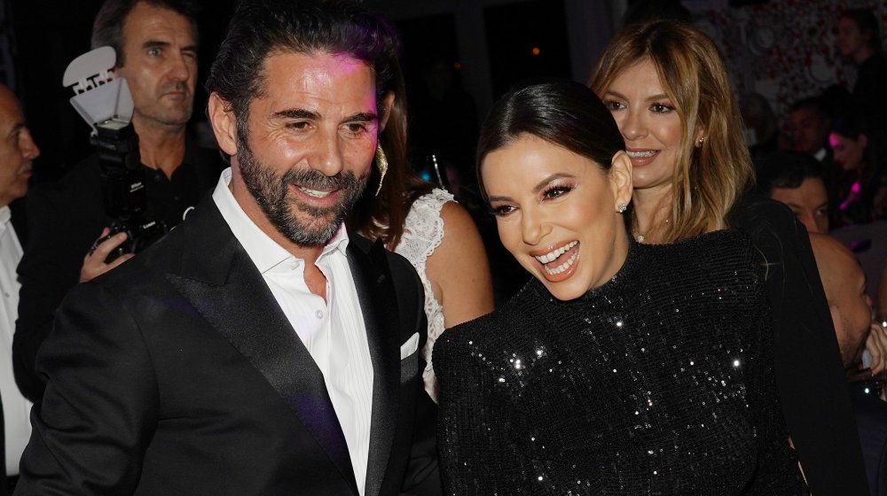 Jose Baston in a suit and Eva Longoria in a sequinned dress together