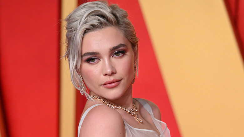 Florence Pugh, smirking