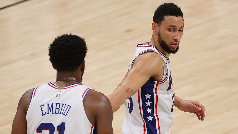 Ben Simmons and Joel Embiid at an event 