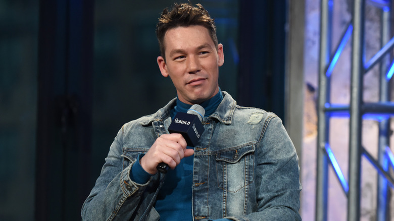 David Bromstad holding a microphone
