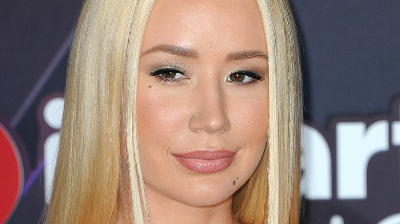 Iggy Azalea poses with slick blond hair.