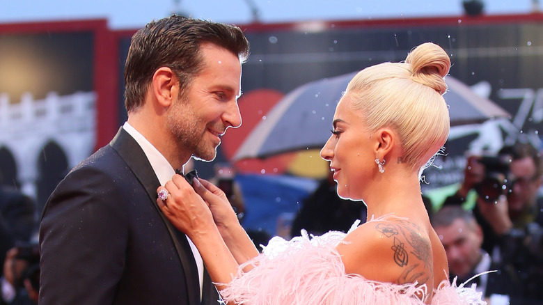 Lady Gaga fixing Bradley Cooper's tie