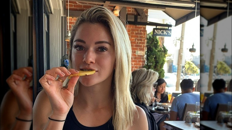 Kealia Watt eating fruit slice