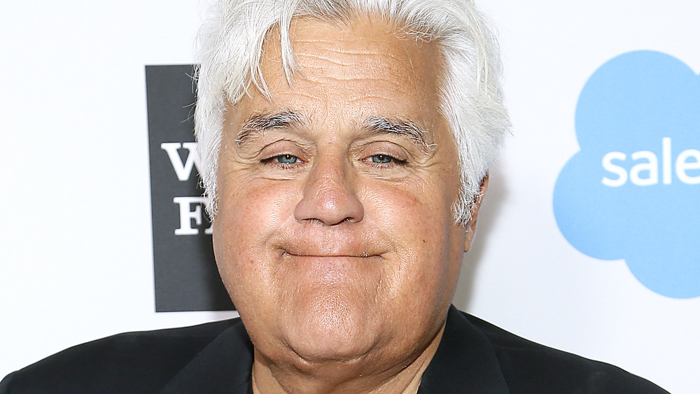 Jay Leno smiling on the red carpet