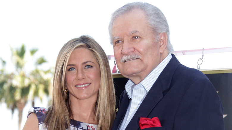 Jennifer and John Aniston pose 