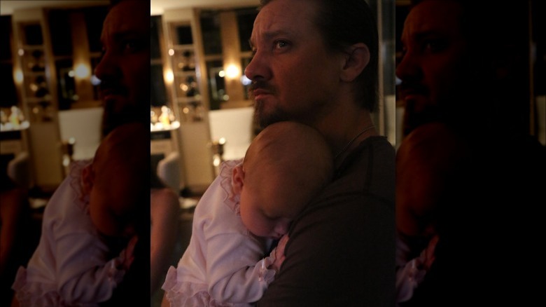 Jeremy Renner holds baby Ava
