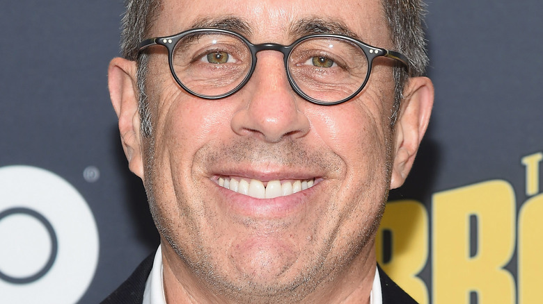 Jerry Seinfeld smiles on the red carpet