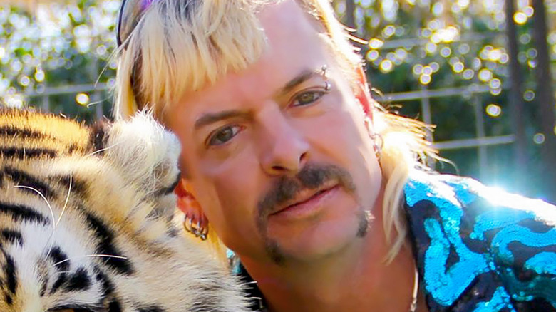 Joe Exotic hugging a tiger