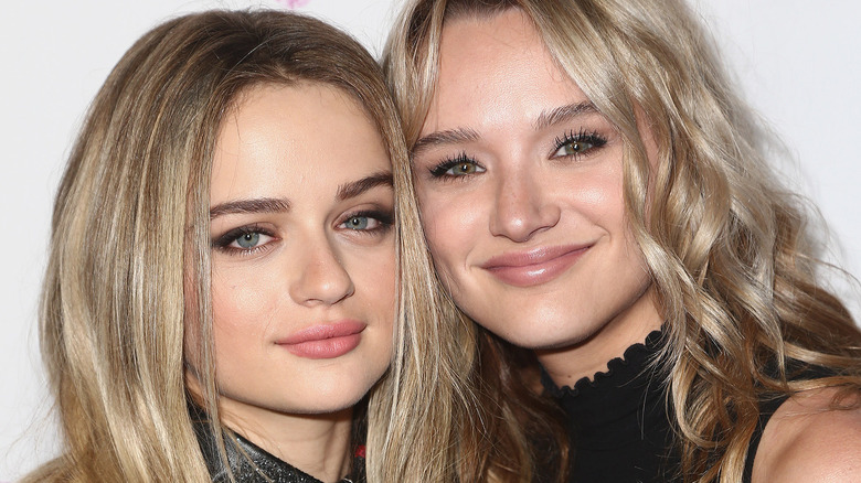 Joey King and Hunter King smiling and hugging 