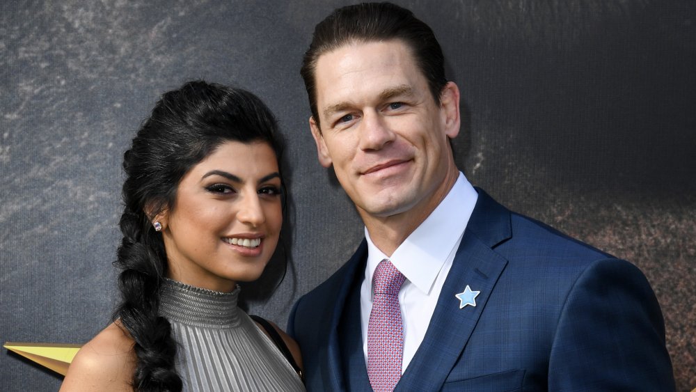 Shay Shariatzadeh and John Cena smiling on the red carpet