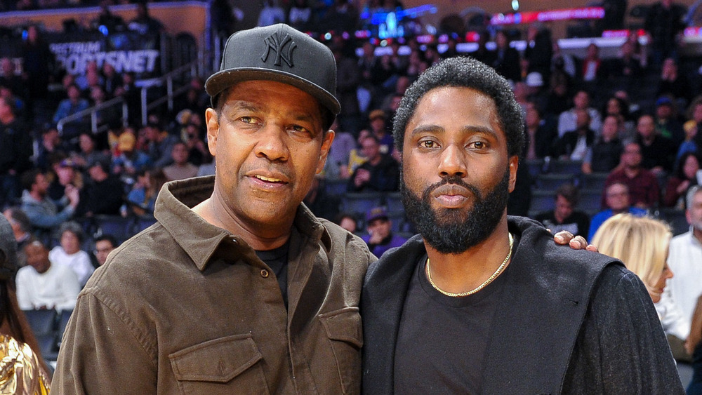 Denzel Washington and John David Washington at a basketball game