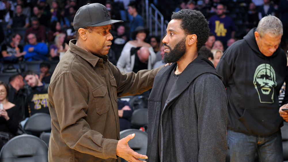 Denzel Washington and John David Washington go in for a hug