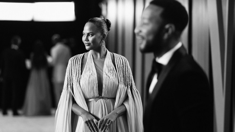 Chrissy Teigen and John Legend in black and white shot