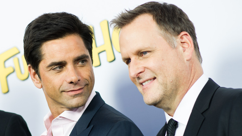 John Stamos looking at Dave Coulier