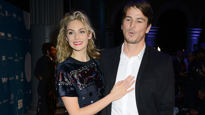 Tamsin Egerton with hand on Josh Hartnett's chest
