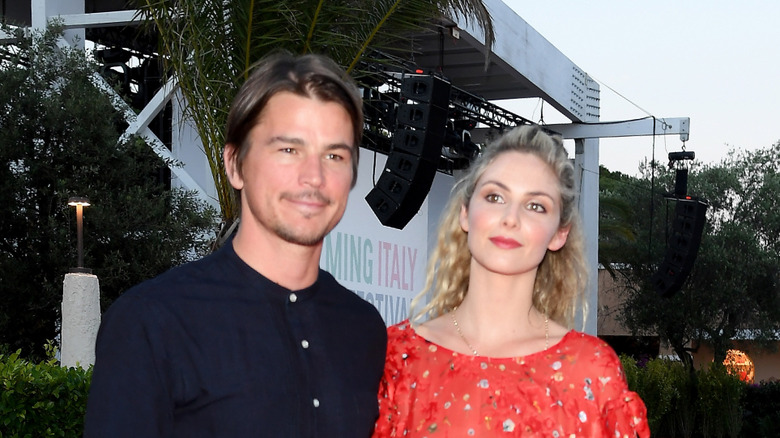 Josh Hartnett and Tamsin Egerton smiling for cameras
