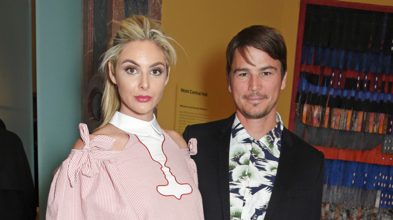 Tamsin Egerton and Josh Hartnett looking at camera