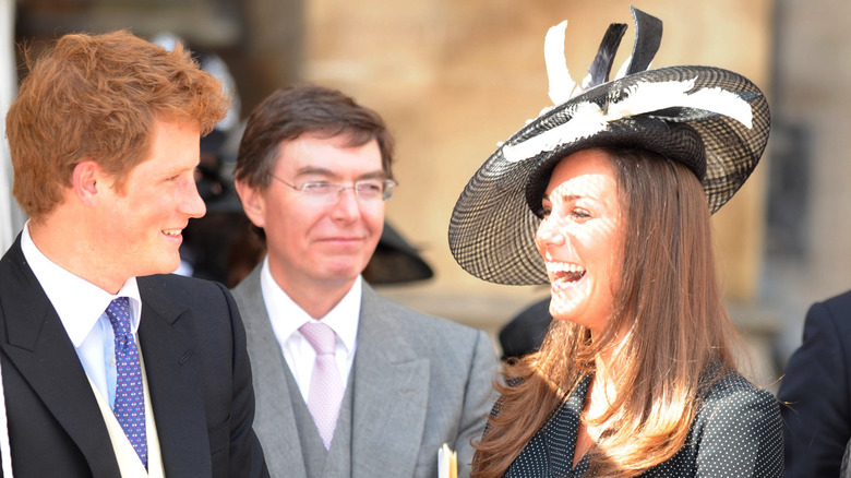 Prince Harry and Kate Middleton laugh in 2008