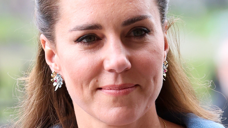 Kate Middleton, half smiling