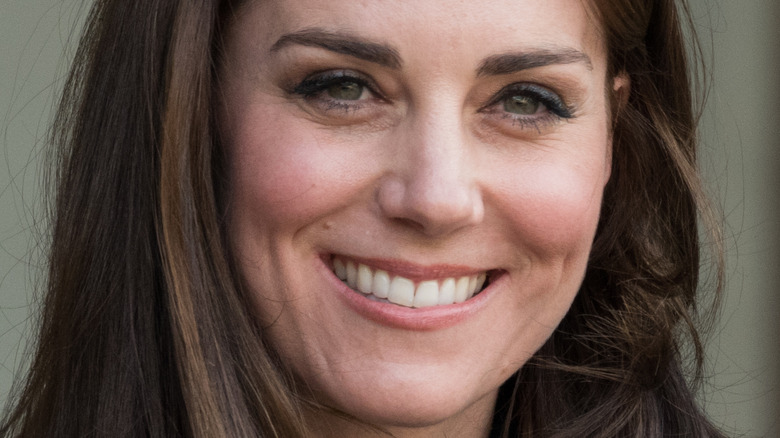 Kate Middleton smiles at the Elysee Palace 