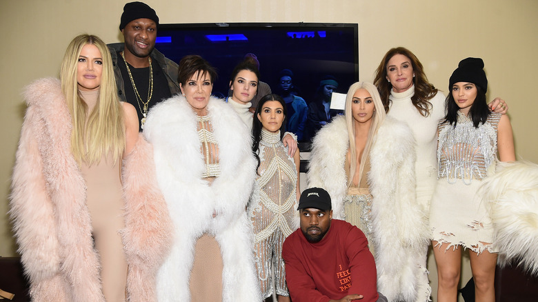 Group photo of the Kardashian-Jennr clan posing with Kanye West and Lamar Odom